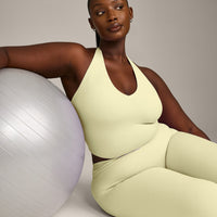 SoftMotion™ Halter Neck Mid Vest with Built in Bra Shelf with Grey Logo | Pastel Yellow
