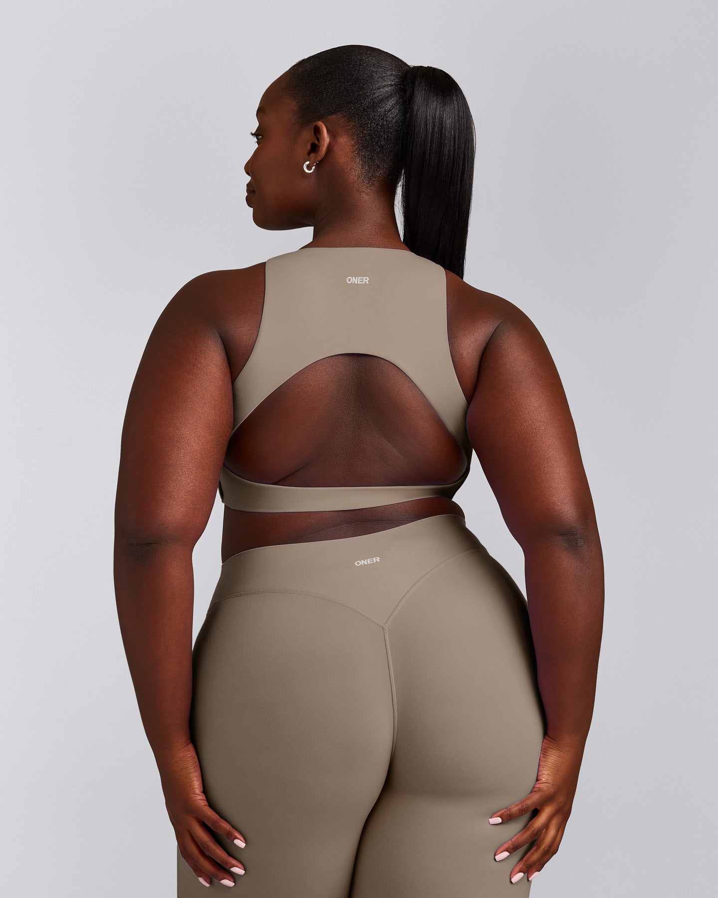 SoftMotion™ High Neck Sports Bra with Grey Logo | Minky
