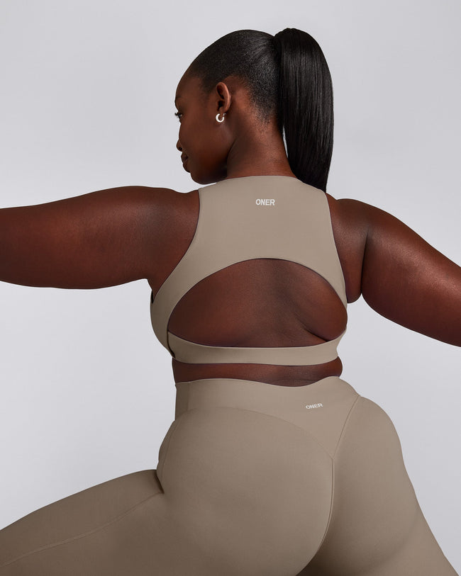 SoftMotion™ High Neck Sports Bra with Grey Logo | Minky