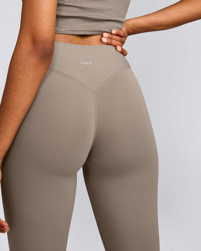 SoftMotion™ High Waisted Capri Leggings with Grey Logo | Minky