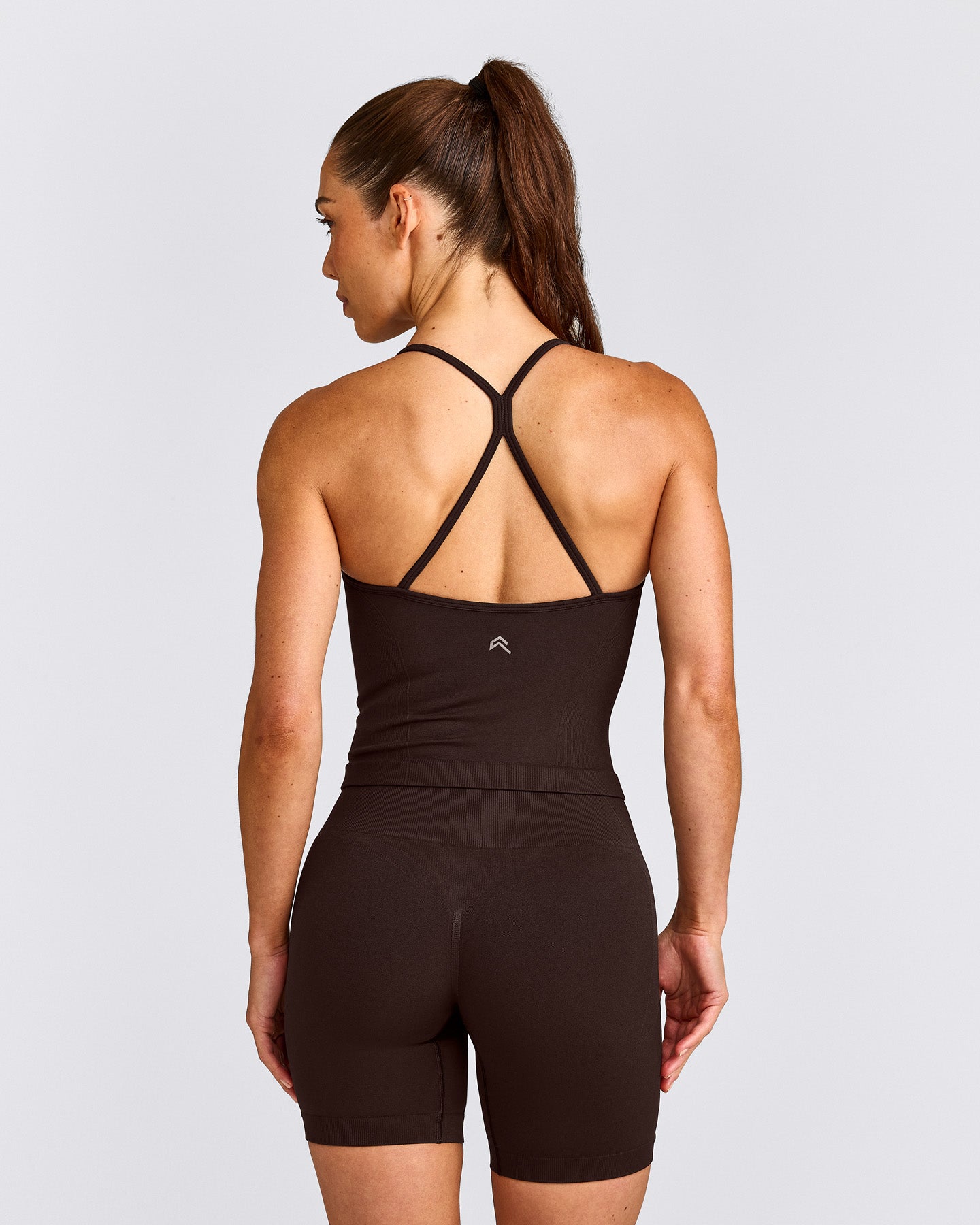 EnhanceLift™ Seamless Strappy Racer Tank Top with Built in Bra Shelf with Grey Logo | 70% Cocoa