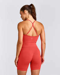 EnhanceLift™ Seamless Strappy Racer Tank Top with Built in Bra Shelf with Grey Logo | Dark Charged Coral