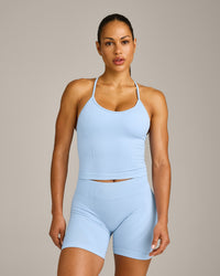 EnhanceLift™ Seamless Strappy Racer Vest with Built in Bra Shelf with Grey Logo | Powdered Blue
