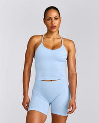 EnhanceLift™ Seamless Strappy Racer Tank Top with Built in Bra Shelf with Grey Logo | Powdered Blue