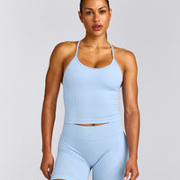 EnhanceLift™ Seamless Strappy Racer Tank Top with Built in Bra Shelf with Grey Logo | Powdered Blue