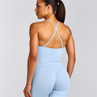 EnhanceLift™ Seamless Strappy Racer Tank Top with Built in Bra Shelf with Grey Logo | Powdered Blue