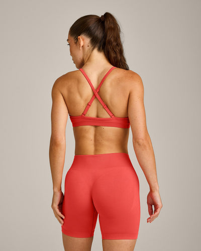 EnhanceLift™ Seamless Strappy Sports Bra with Grey Logo | Dark Charged Coral