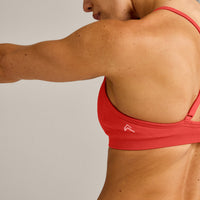 EnhanceLift™ Seamless Strappy Sports Bra with Grey Logo | Dark Charged Coral