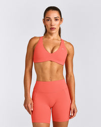 UnifiedMove™ Cross Back Sports Bra with Reflective Logo | Light Charged Coral