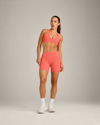 UnifiedMove™ Cross Back Sports Bra with Reflective Logo | Light Charged Coral