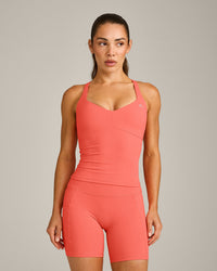 UnifiedMove™ T Back Mid Vest with Built in Bra Shelf with Reflective Logo | Light Charged Coral