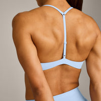 UnifiedMove™ T Back Minimal Bralette with Reflective Logo | Powdered Blue