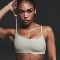 SoftMotion™ Strappy Sports Bra with Grey Logo | Oatmeal