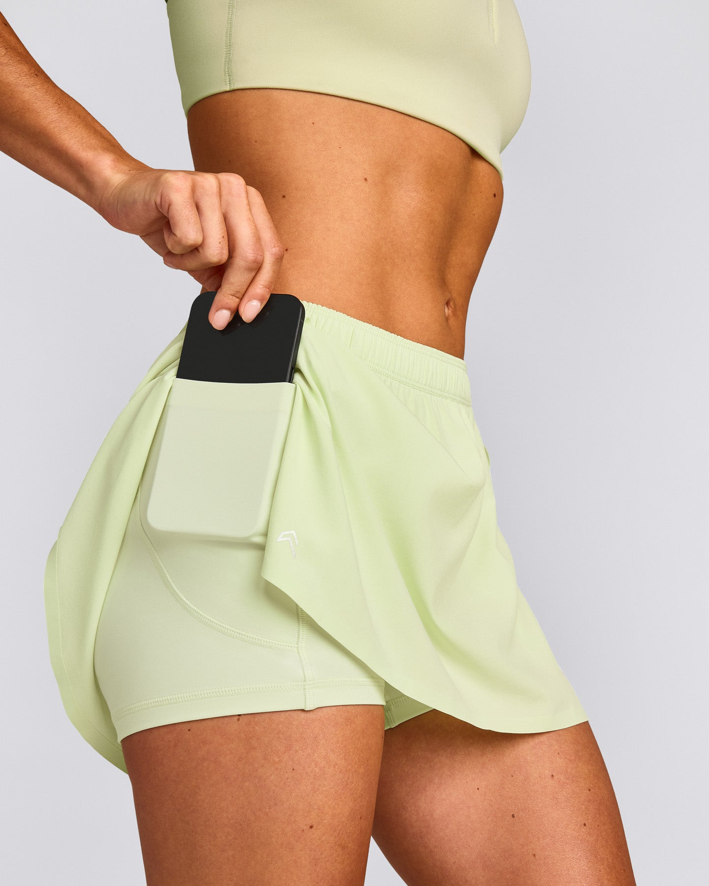 AirMove™ Skort with Pockets New Branding | Meadow Mist Green