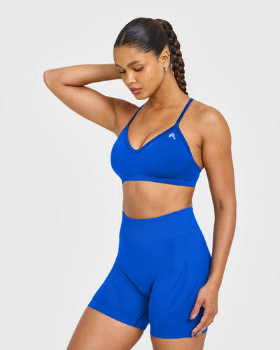 EnhanceLift™ Seamless Strappy Sports Bra with White Logo | Cobalt Blue