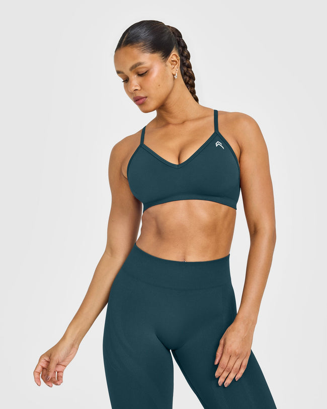 EnhanceLift™ Seamless Strappy Sports Bra with White Logo | Washed Oil Blue