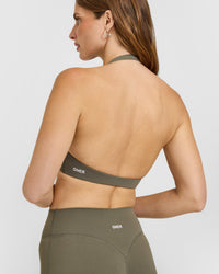 SoftMotion™ Minimal Halter Neck Bralette with White Logo | Alpine Green