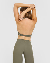 SoftMotion™ Minimal Halter Neck Bralette with White Logo | Alpine Green