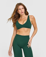 SoftMotion™ Scoop Back Bralette with White Logo | Dark Racing Green