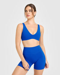 SoftMotion™ Scoop Back Bralette with White Logo | Light Cobalt Blue